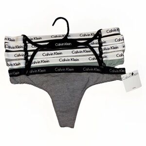 Calvin Klein White Price Tag with Yellow Accent